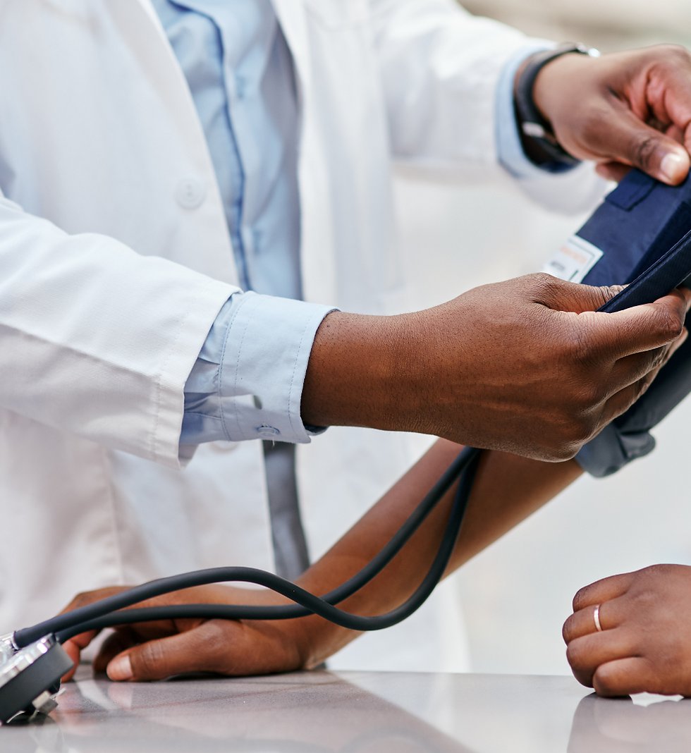 Clinician checking a patient’s blood pressure